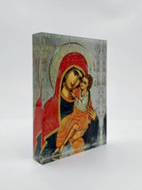 A handcrafted icon depicting the Virgin Mary with a child, in vibrant colors with gold accents, designed and handcrafted in Greece.