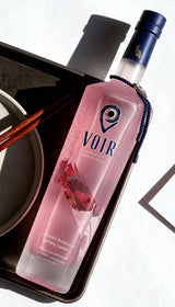 Bottle of Cherry Flavoured Vodka on a dark background