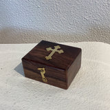 Wooden box with brass cross