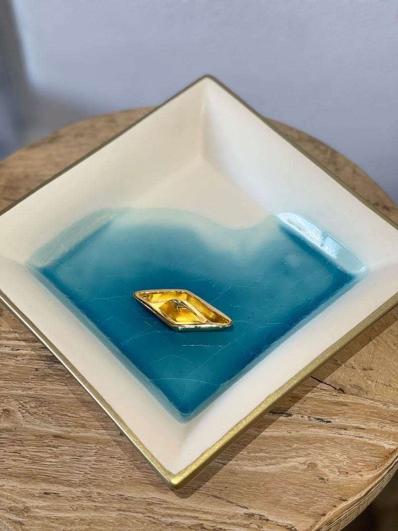 Large cream ceramic plate with gold boat