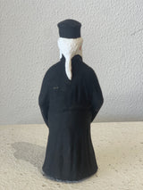 Priest Figurine holding White Cross