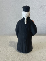 Priest Figurine holding Picture of Jesus