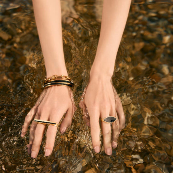 an almond eye shaped ring made fro black polyamide encased in brass gold plated. A unique modern take on the eye ring. by Greek Designer. hand made in Greece